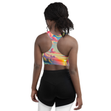 Pink Solitude Surreal Style Sports Bra with a bold and surreal design inspired by nature. Back view on model.