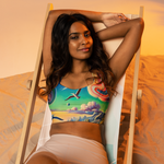 Radio Beach Surreal Style Sports Bra with a unique and vibrant ocean-inspired design. Front beach sitting.